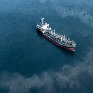 Oil slips Mina running