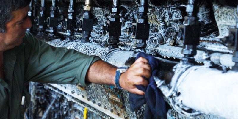 man cleaning down pipes